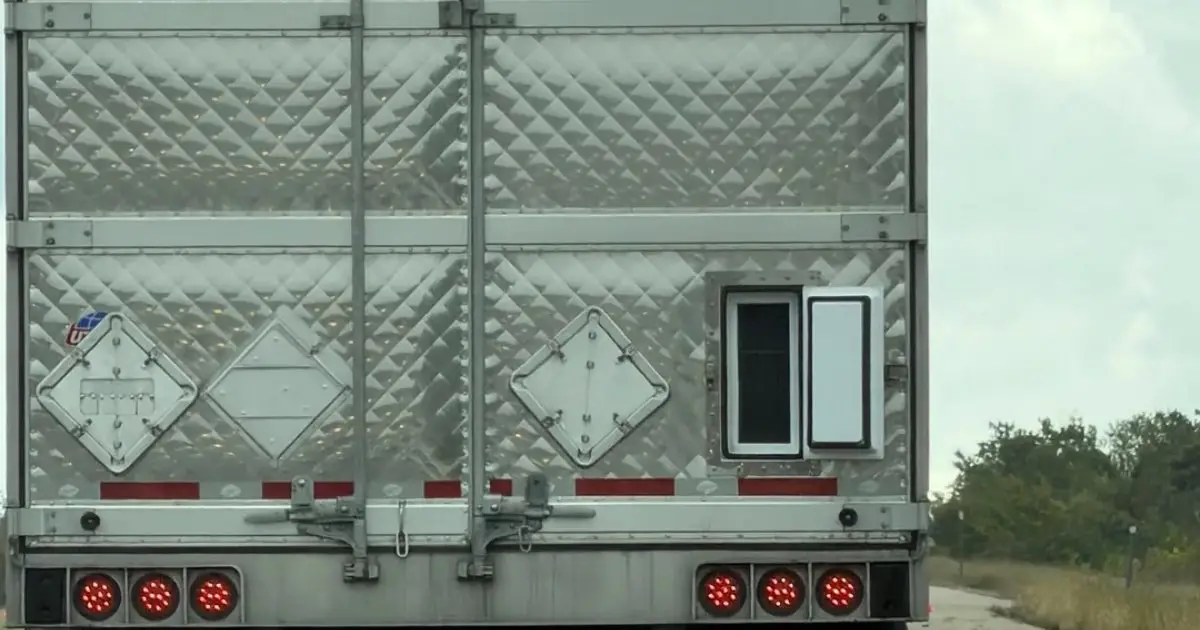 A rear vent door on a semi-truck trailer